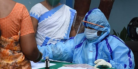 A woman registering her name to get COVID-19 test at an Urban Primary Health Centre in Hyderabad (Photo | RVK Rao, EPS)