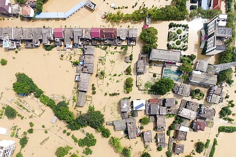 In this aerial photo released by Xinhua News Agency, a village is flooded in Sanjiao Township of the Yongxiu County in eastern China's Jiangxi Province Monday, July 13, 2020. (Photo | AP)