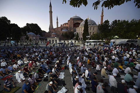 Muslims offer prayers outside the Byzantine-era Hagia Sophia following Turkey's Council of State's decision that paved the way the landmark monument be turned from a museum into a mosque. (Photo | AP)