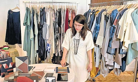 Sajal Jain at her studio with her upcycled designs on display