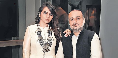Rimple and Harpeet Narula; (below) complimentary masks with every  garment from the Karawan collection
