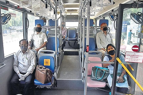 People maintain social distancing onboard a Delhi Transport Corpration bus (File Photo)