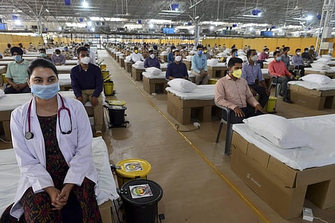 ITBP personnel and health workers inside the Sardar Patel COVID Care Centre and Hospital in New Delhi. (File Photo | PTI)