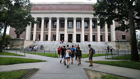 Students walk near the Widener Library in Harvard Yard at Harvard University in Cambridge. (Photo | AP)