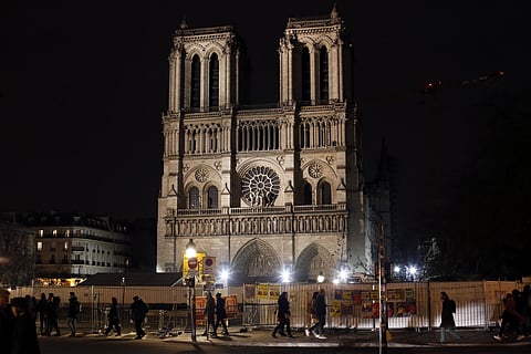 The medieval landmark is under reconstruction after a devastating fire last year and is off-limits to the public. (Photo | AP)