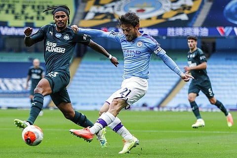 Manchester City's David Silva shots past Newcastle's Valentino Lazaro, left, during the English Premier League soccer match between Manchester City and Newcastle. (Photo | AP)