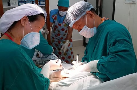 Dr ZR Thiamsanga (right) operating on the pregnant woman (Photo| EPS)