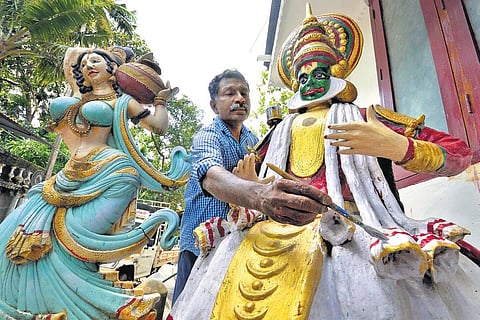 G Uthamadas giving finishing touches to a sculpture  he made at his warehouse at Kalliyoor in Thiruvananathapuram on Tuesday