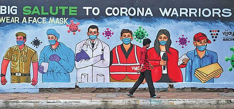 A mural painted by civic body to salute corona warriors and sensitise public on use of face masks. (Photo | Prasant Madugula, EPS)