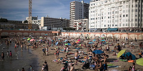 Beachgoers enjoy the sun at the Plage des Catalans in Marseille, southern France.(File photo| AP)