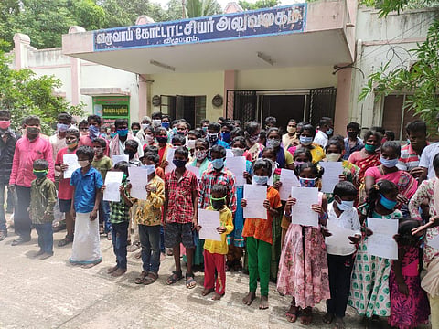 Irula families from T Parangini village  at the Villupuram Revenue Divisional Officer’s office (Photo | Express)