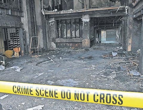 Police tape mark off Hotel Swarna Palace, where 10 patients were killed in a fire accident, in Vijayawada. File Photo | Prasant Madugula, EPS)