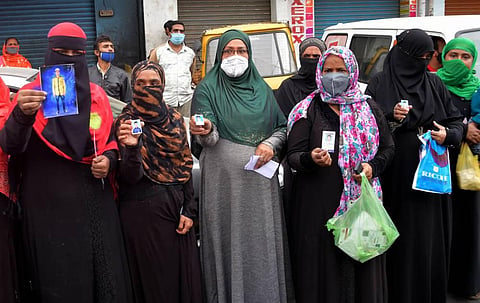 After 342 men have been arrested in DJ Halli women take to the streets to protest in front of the police station. (Photo | Meghana Sastry/EPS)