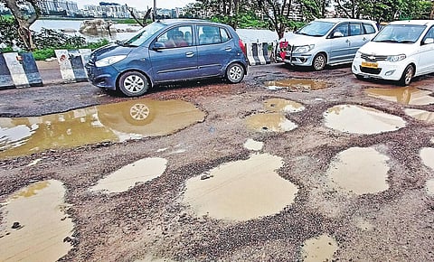 A road near Kukatpally damaged in the recent rains  | RVK RAO