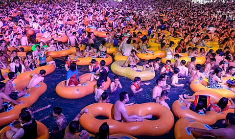 The water park reopened in June after Wuhan gradually opened up after a 76-day lockdown and strict restrictions to try and control the spread of the virus. (Photo | AFP)