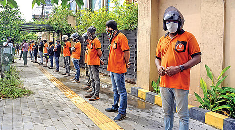Demanding the reinstation of over 100 employees, delivery incentives and other benefits, delivery persons of Swiggy protest. (File Photo| A Sanesh,EPS)