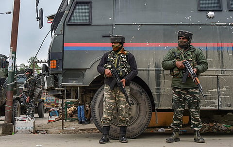 File photo of security personnel standing guard during an encounter with the militants in Jammu and Kashmir. 
