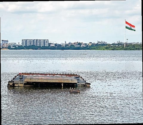 The upturned amphibious excavator on Hussainsagar | RVK Rao