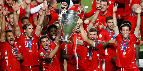 Bayern Munich players lift the trophy after they won the Champions League final against PSG at the Luz stadium in Lisbon. (Photo | AP)