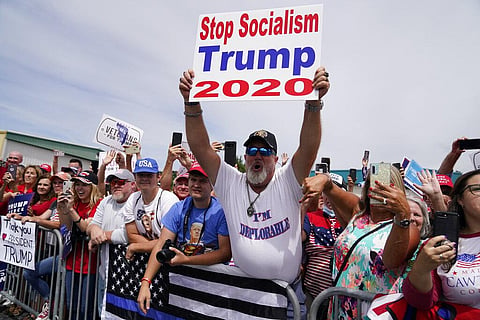 People people cheer as they wait to hear President Donald Trump speak at Asheville Regional Airport, Monday, Aug. 24, 2020, in Fletcher, N.C. (Photo | AP)