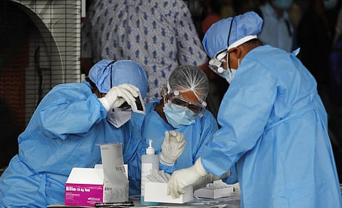 Health workers conduct COVID-19 antigen tests for migrant workers in New Delhi, India, Aug. 18, 2020. (Photo | PTI)