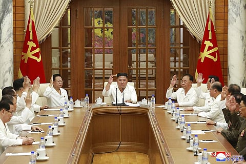 In this photo provided by the North Korean government, North Korean leader Kim Jong Un, center, attends an enlarged meeting of the Politburo of the ruling Workers’ Party in Pyongyang. (Photo | AP)