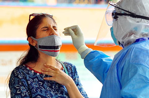 Health workers collecting Samples of Covid-19 test in Visakhapatnam on Friday. (Photo | G Satyanarayana, EPS)