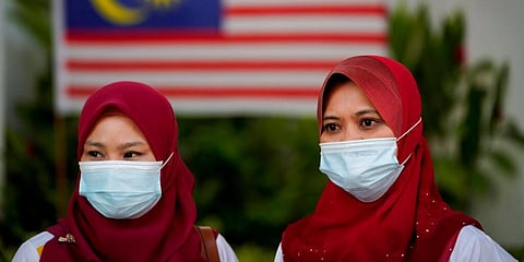 Malaysian women wearing face mask to help curb the spread of the coronavirus. (Photo | AP)