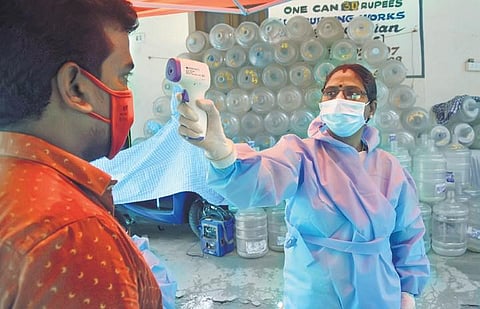 Thermal scan being done at a fever camp by doctors and corporation officials at  T Nagar in Chennai | ashwin prasath