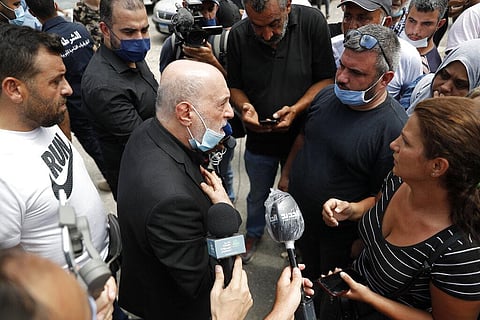 Amin Sherri, a Lebanese lawmaker of the Hezbollah bloc, center, speaks with families of the victims who were missing from the Aug. 4 explosion that hit the seaport of Beirut, Lebanon. (Photo | AP)