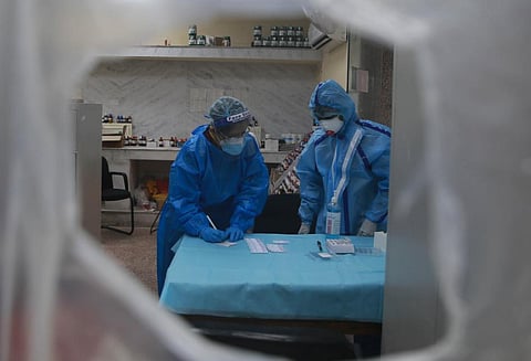 Health workers collect swab samples for coronavirus through rapid antigen tests. (File photo| Shekhar Yadav, EPS)