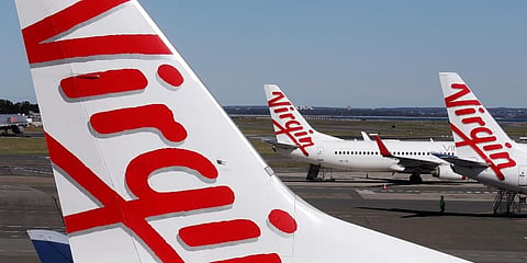 Virgin Australia planes are parked at terminal at Sydney Airport in Sydney, Wednesday, Aug. 5, 2020. (Photo | AP)