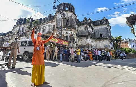 A sadhu celebrates the ground breaking ceremony for proposed Ram Temple near Ramjanmabhoomi in Ayodhya (Photo | PTI)