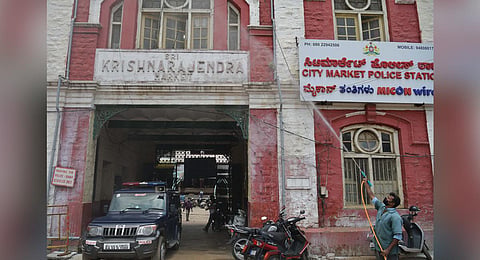 A BBMP staffer sanitises KR Market on Monday |Meghana Sastry