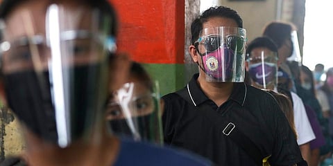 People wearing face mask and face shields to help curb the spread of COVID-19 in Philippines. (Photo | AP)