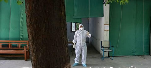 A health worker wearing PPE kit at a Covid-19 rapid testing center. (Photo | Shekhar Yadav, EPS)