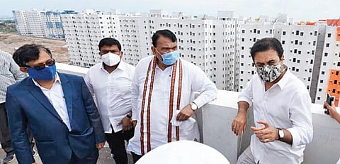 MAUD Minister KT Rama Rao and Assembly Speaker Pocharam Srinivas Reddy inspect the 2BHK dignity housing project site at Kollur on Thursday to review the various amenities being provided.