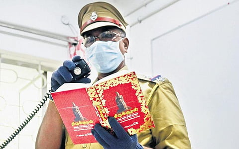 Officer reciting the couplets at the control room in Vellore | Express