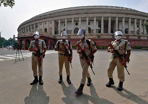 Security Personnel wearing face shields and masks patrol the premises of Parliament House in New Delhi Sunday Sept. 13 2020.  (Photo | PTI)