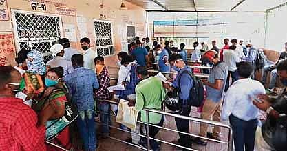 People queue up at the office of Registrar for Births and Deaths  ignoring social distancing norms in Bhubaneswar. (Photo | EPS/Irfana)