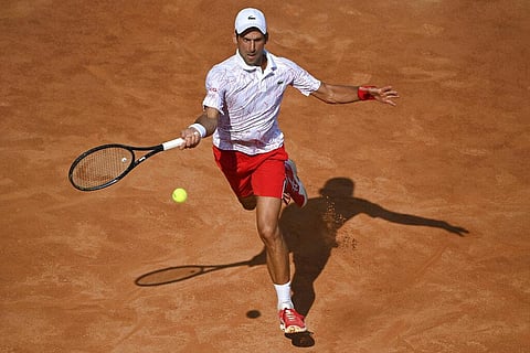 Serbia's Novak Djokovic returns the ball to Serbia's Filip Krajnovic during their Italian Open tennis tournament match, in Rome, Friday, Sept. 18, 2020.  (Photo | AP)