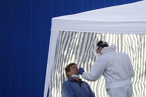 A man gets tested for COVID-19 at a sampling station in Prague, Czech Republic. (Photo | AP)