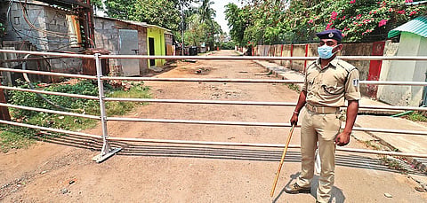 A cop guards a containment zone. (File Photo | Irfana, EPS)