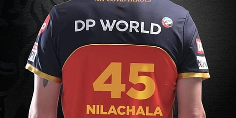 Chris Morris wearing the RCB jersey with Nilachala Parida's name. (Twitter Photo)