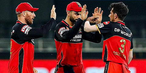 RCB players celebrate the wicket of SRH batsman Manish Pandey during a cricket match of IPL 2020 at Dubai International Cricket Stadium. (Photo | PTI)