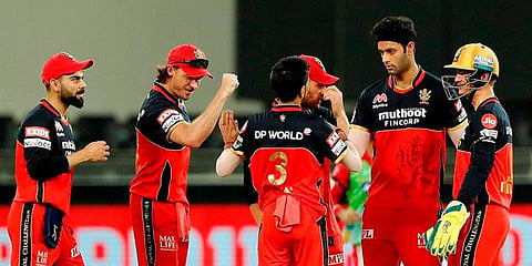Royal Challengers Bangalore players celebrate the wicket of Kings XI Punjab batsman Mayank Agarwal. (Photo | PTI)