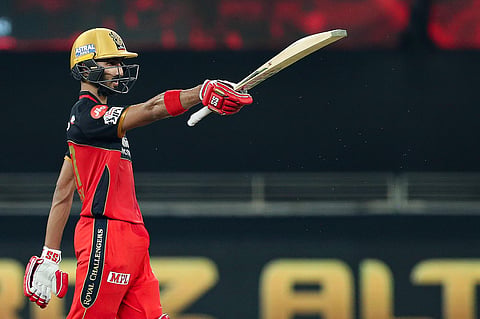 Royal Challengers Bangalore batsman Devdutt Padikkal celebrates his half century during the IPL 2020 cricket match against Mumbai Indians, at Dubai International Cricket Stadium. (Photo | PTI)