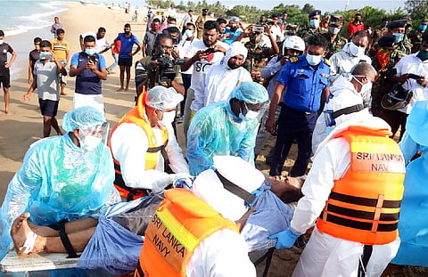 An injured crew member of the MT New Diamond, is transferred on stretcher to an ambulance Thursday, Sept. 3, 2020, in Sangamankanda, Sri Lanka. (Photo | AP)