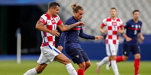 France's Antoine Griezmann (R) duels for the ball with Croatia's Dejan Lovren during their UEFA Nations League match at the Stade de France stadium in Saint-Denis. (Photo | AP)