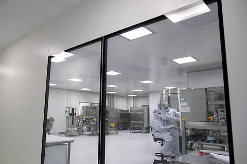 Laboratory technicians work at the mAbxience biopharmaceutical company on an experimental coronavirus vaccine. (File photo | AP)